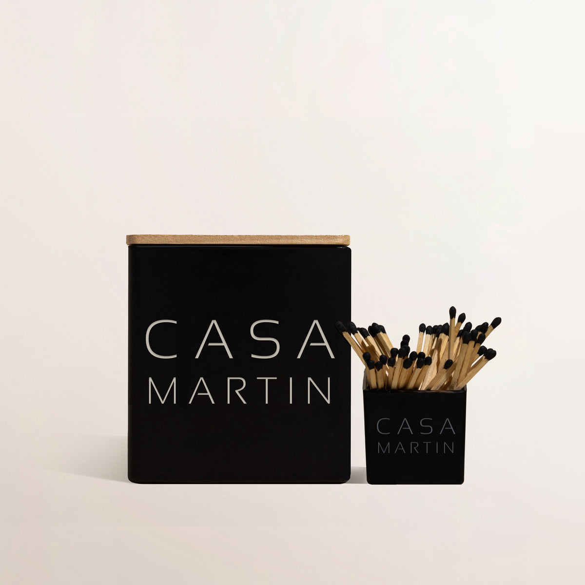 Black Casa candle engraved Martin with a matching black match holder