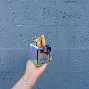 person holding iridescent smudge kit