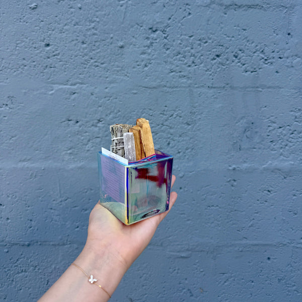 person holding iridescent smudge kit