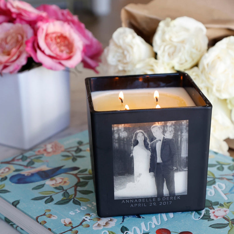 candle surrounded by beautiful flowers. black super size. photo engraved and personalized