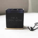 I'm a cool mom black, super size candle with a black wick trimmer