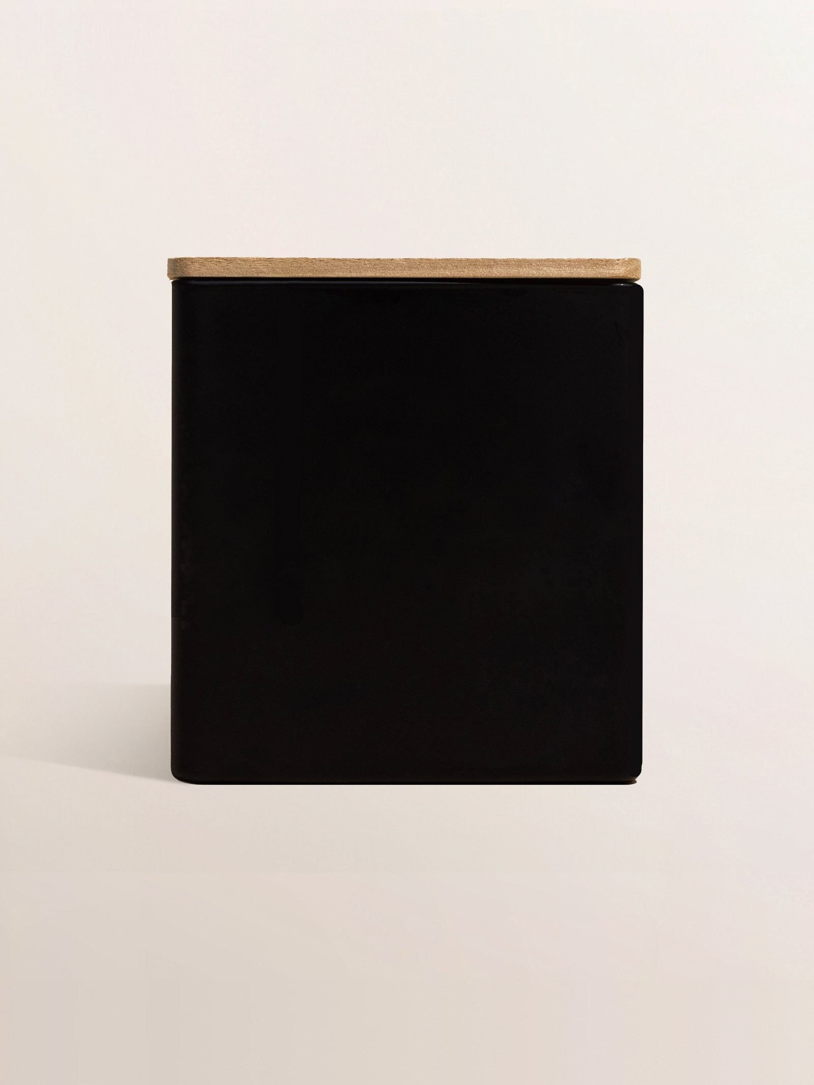 Matte black jar with a wood lid