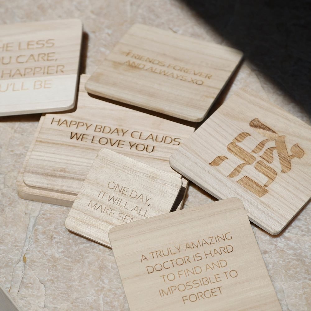 Engraved wooden lids with messages and logos