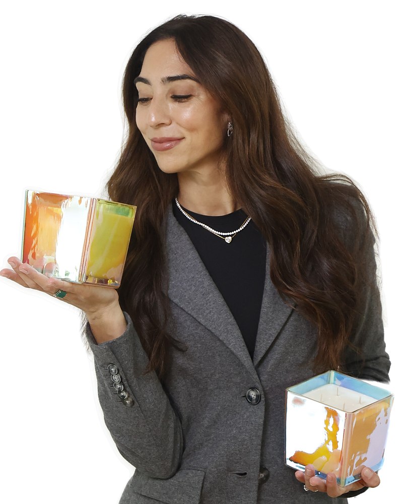 Annabelle holding two iridescent candles
