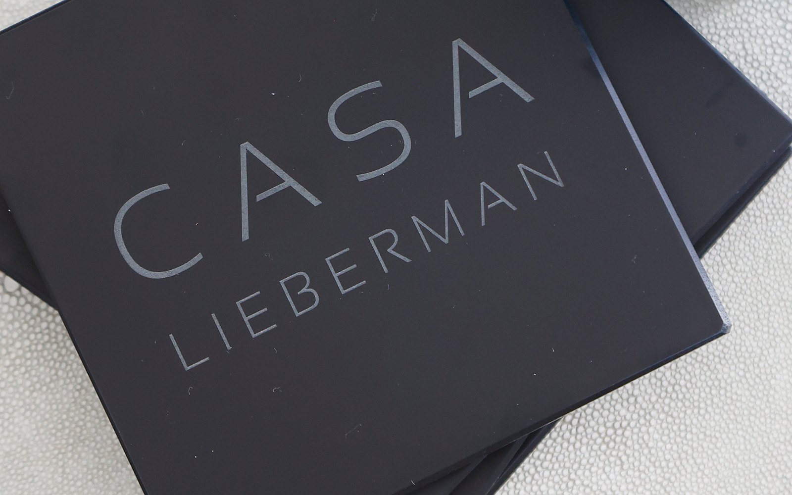 Black coasters engraved Casa Lieberman