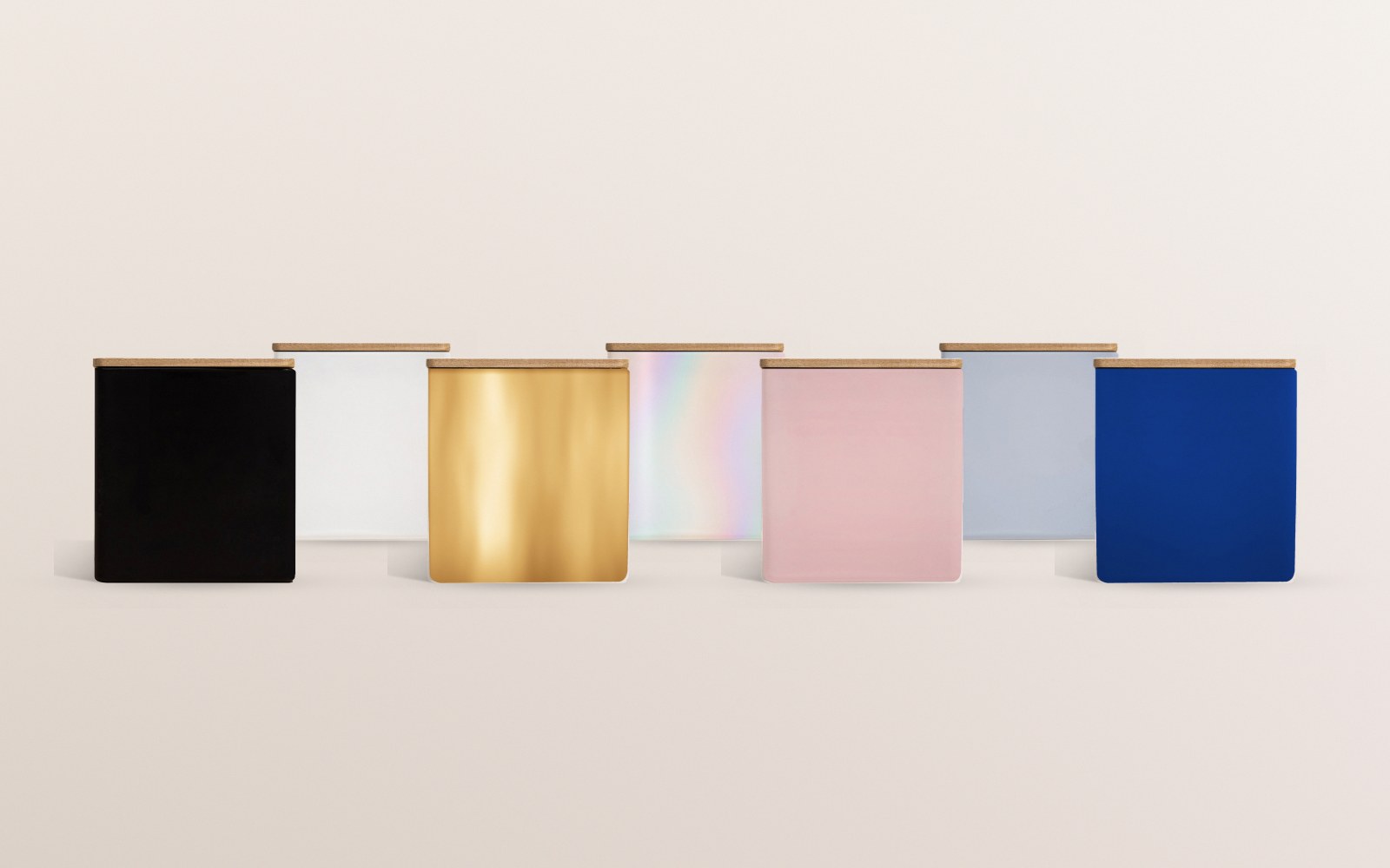 The same blank jar in all seven colors: black, white, gold, iridescent, blush, powder blue and blue