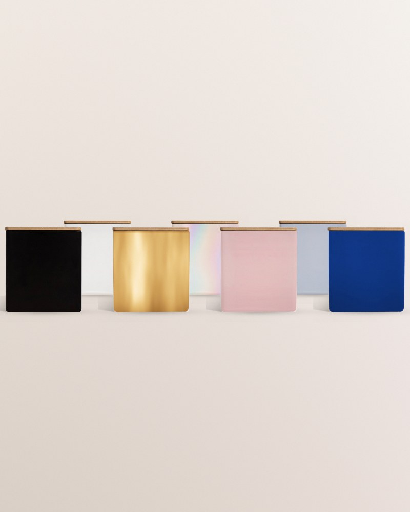 The same blank jar in all seven colors: black, white, gold, iridescent, blush, powder blue and blue