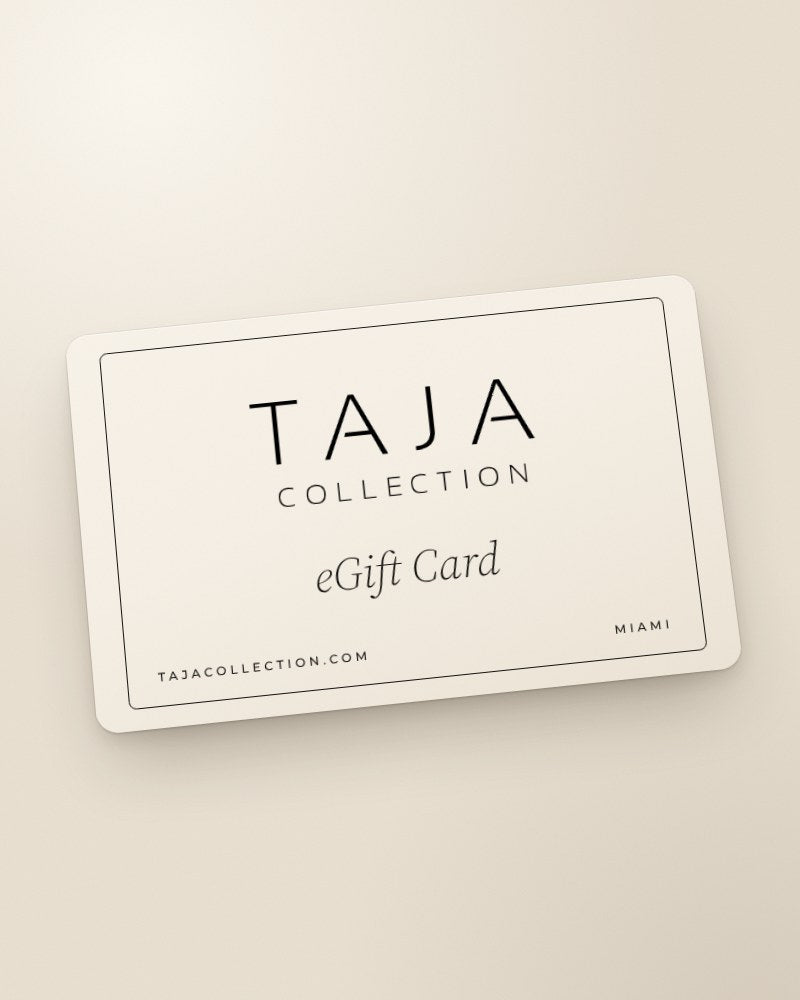 A bone TAJA eGift Card with a black hairline border