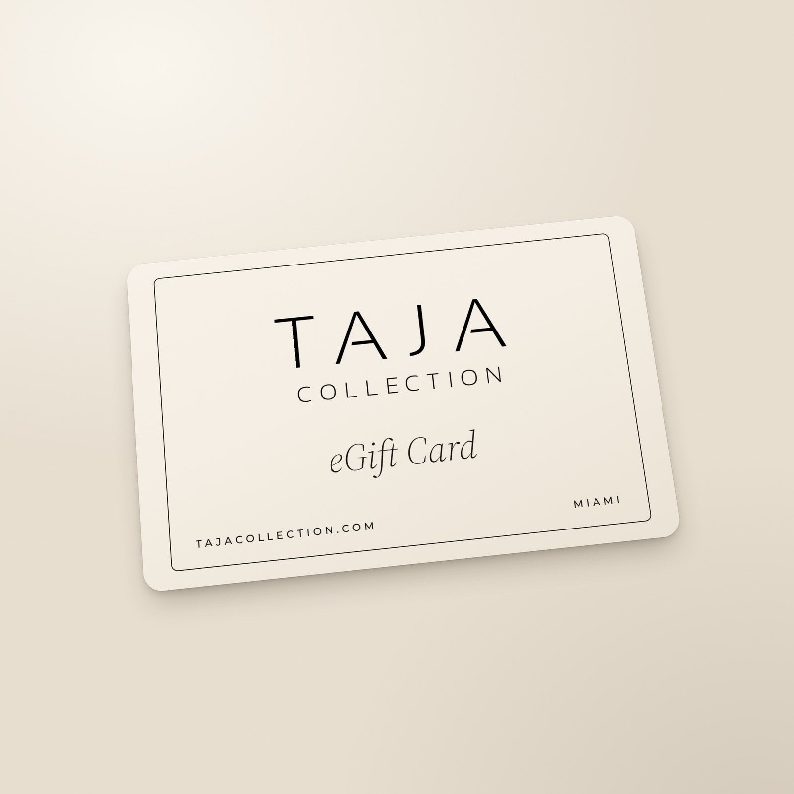 A bone TAJA eGift Card with a black hairline border, the TAJA Collection logo and eGift Card in black